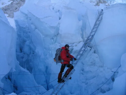 Alan Mallory Climbing Ladder in Khumbu Icefall